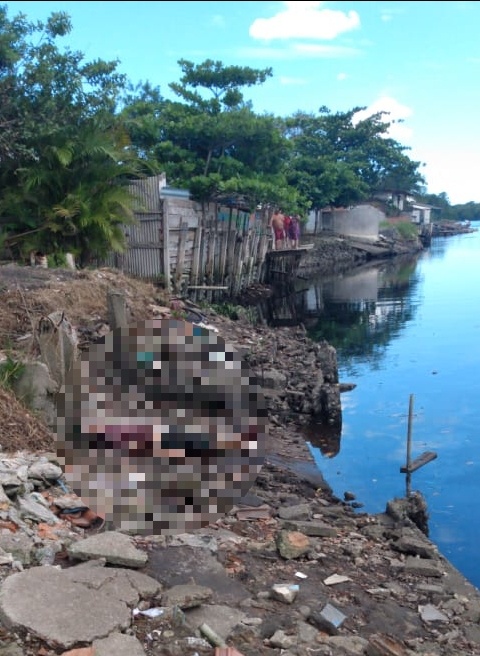 Corpo é encontrado às margens de rio na Baixada do Santos Dumont